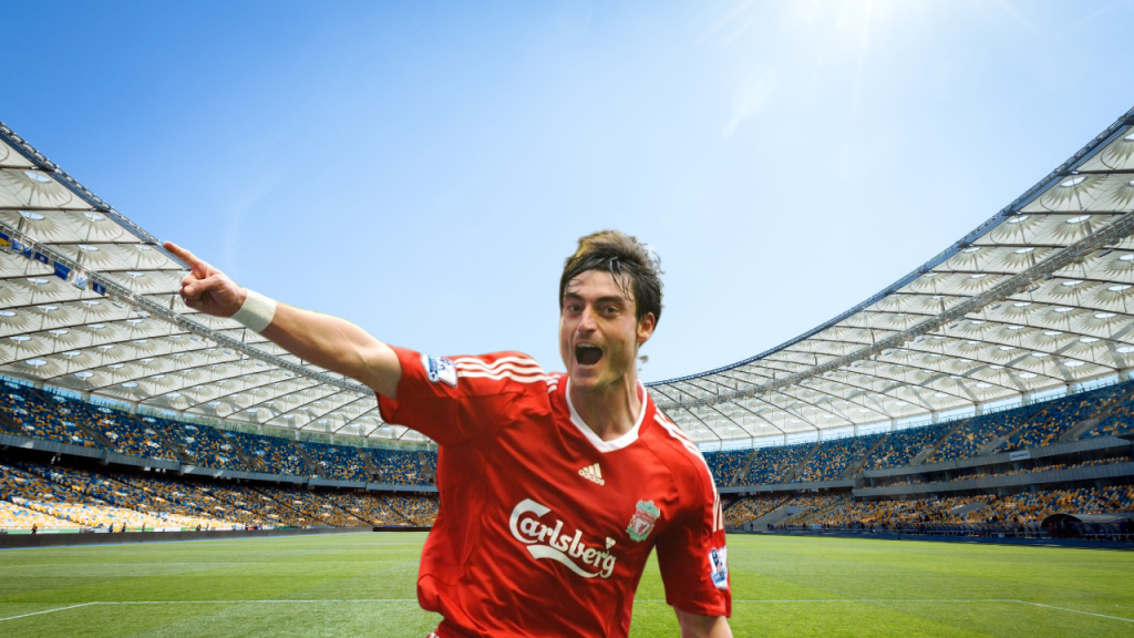 Albert Riera in action during a professional football game, showcasing the former Liverpool winger’s skill and leadership on the pitch