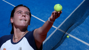Emma Navarro delivers a powerful forehand during an intense professional tennis tournament match