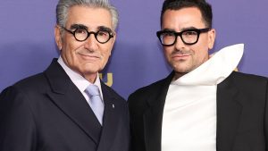Dan Levy posing for a portrait highlighting his career journey and modern aesthetic